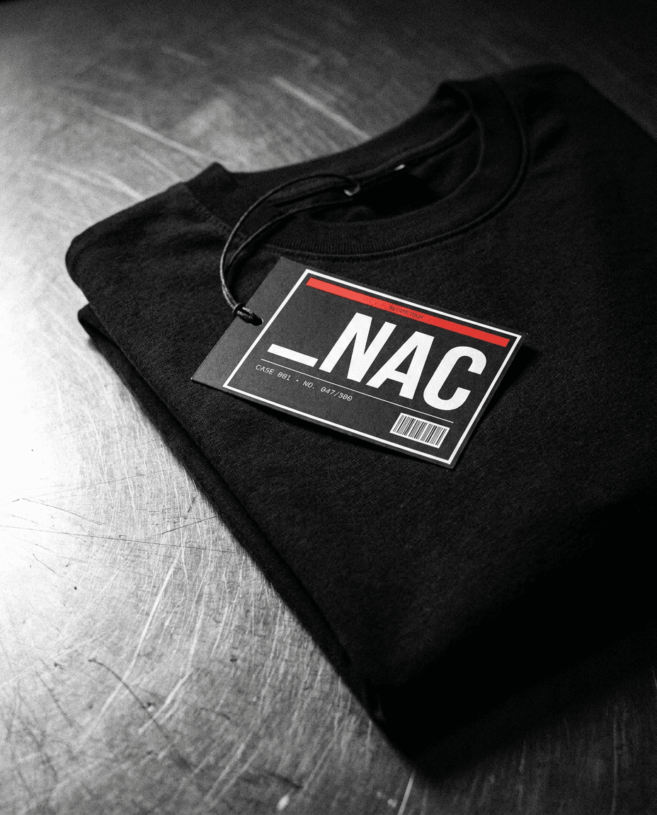 Numbered _NAC hang tag resting on a folded garment